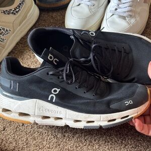 On Running Women’s Black and White Athletic Shoes with Tan Sole